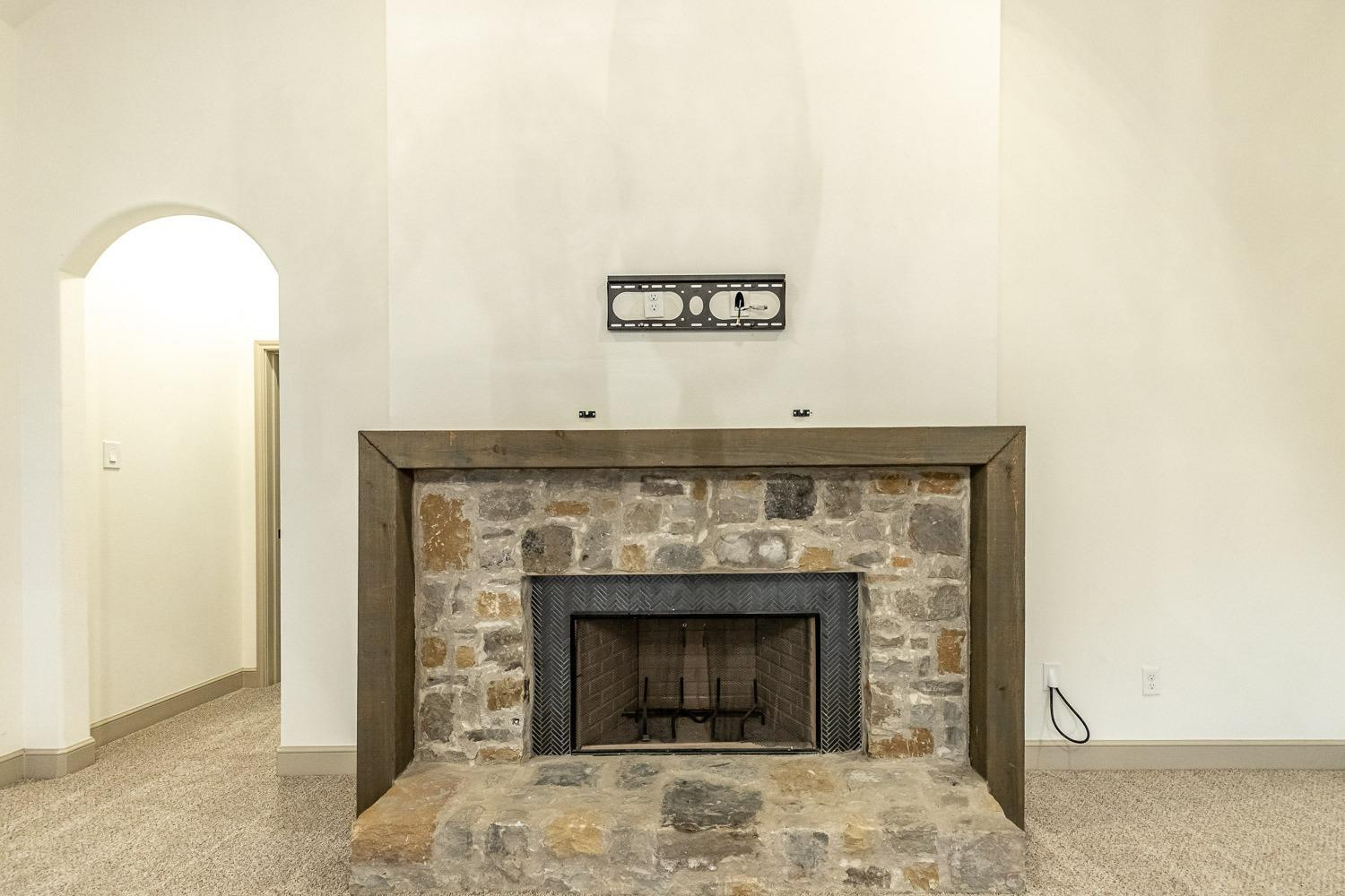 3633 133rd Street Lubbock, TX 79423 - Photo 6 of 46 a view of fireplace and a hallway
