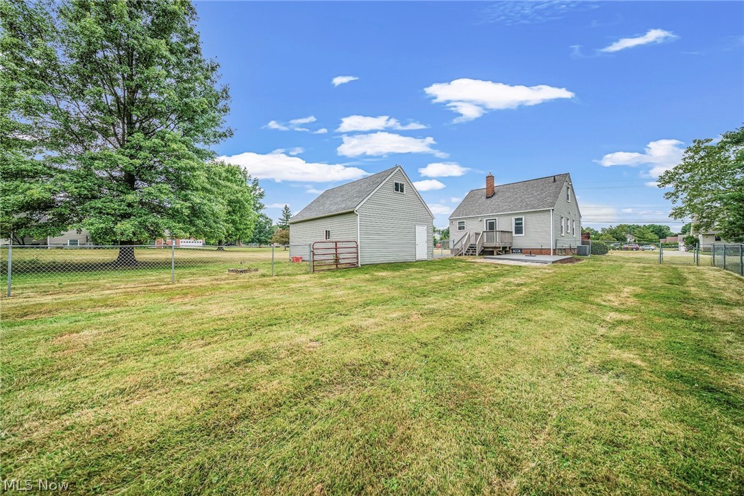 Deep back yard with fenced area