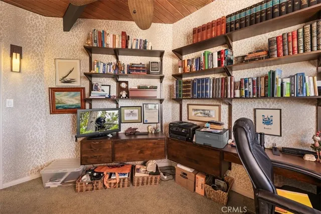a work room with furniture and book shelf