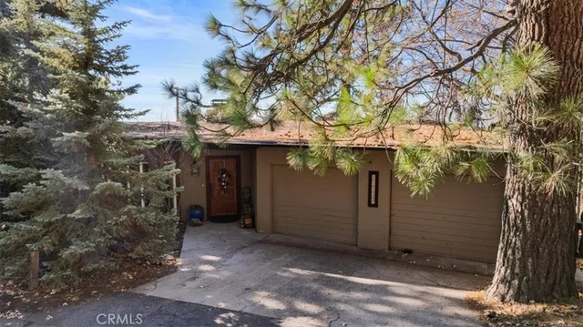 a view of a house with a tree