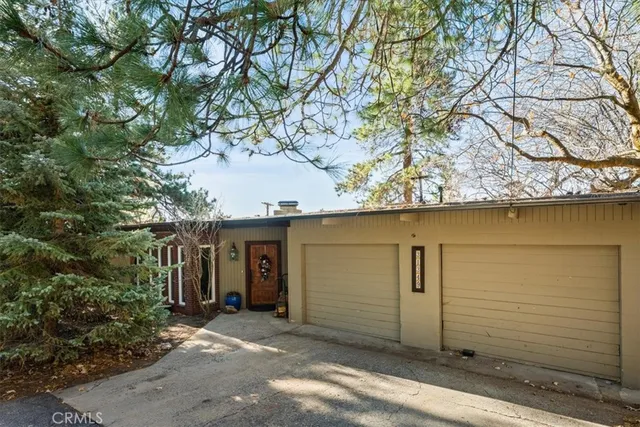 a view of a house with a tree