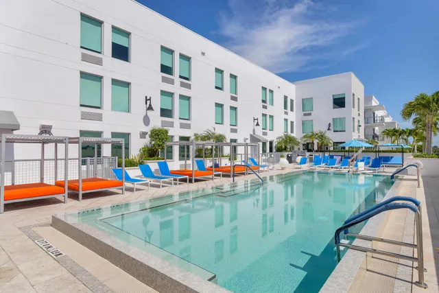 a view of swimming pool with outdoor seating