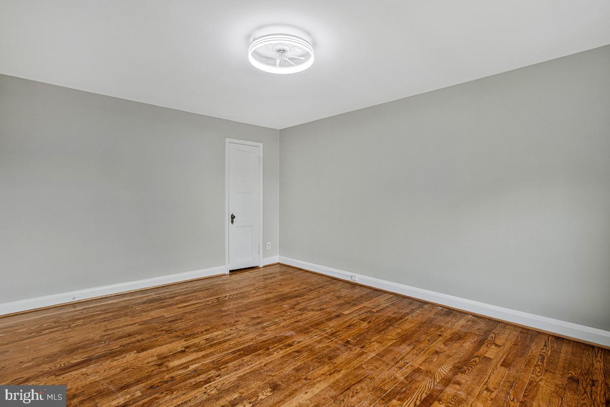 3040 Federal Street Baltimore, MD 21213 - Photo 19 of 41 a view of an empty room with wooden floor
