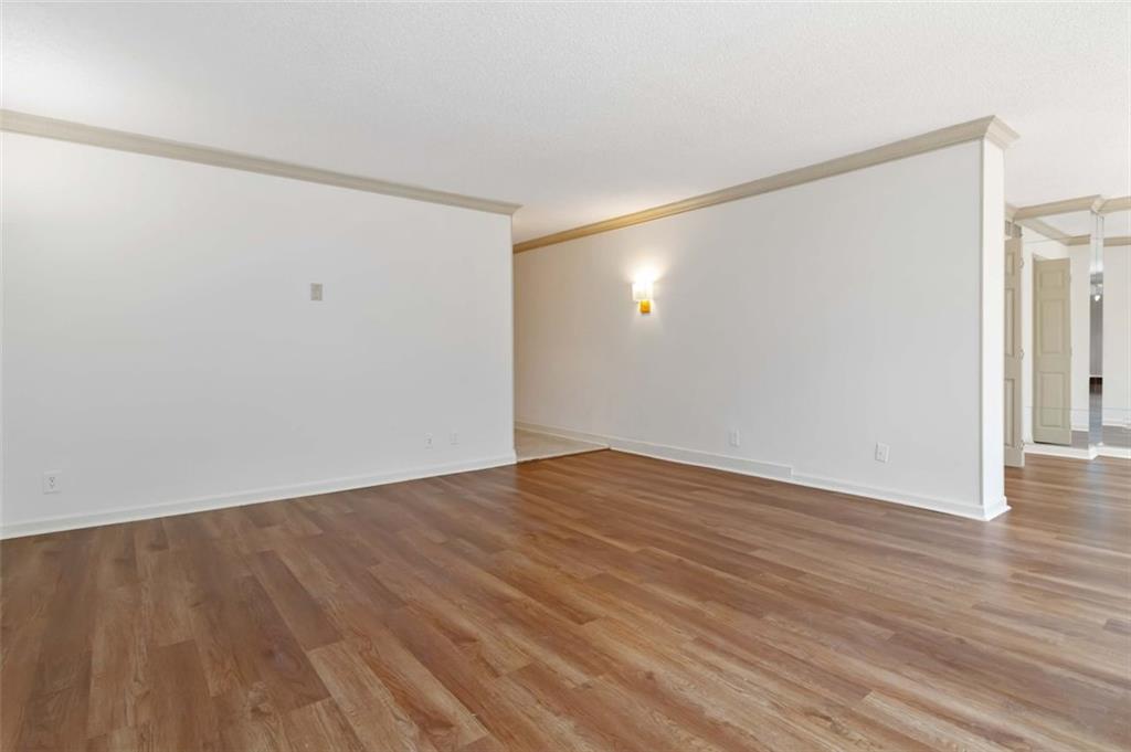 3530 Piedmont Road Northeast, Unit 5A Atlanta, GA 30305 - Photo 15 of 47 a view of an empty room with wooden floor