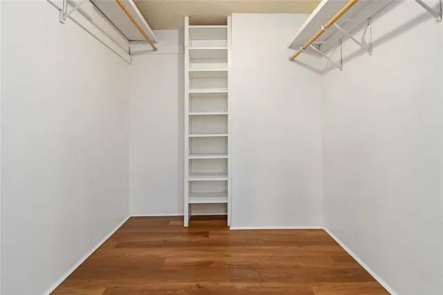 a view of a room with stairs and a closet