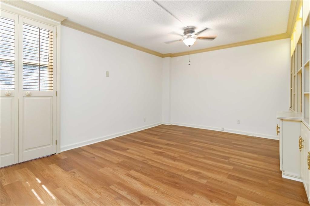 3530 Piedmont Road Northeast, Unit 5A Atlanta, GA 30305 - Photo 31 of 47 a view of a room with a ceiling fan and a window
