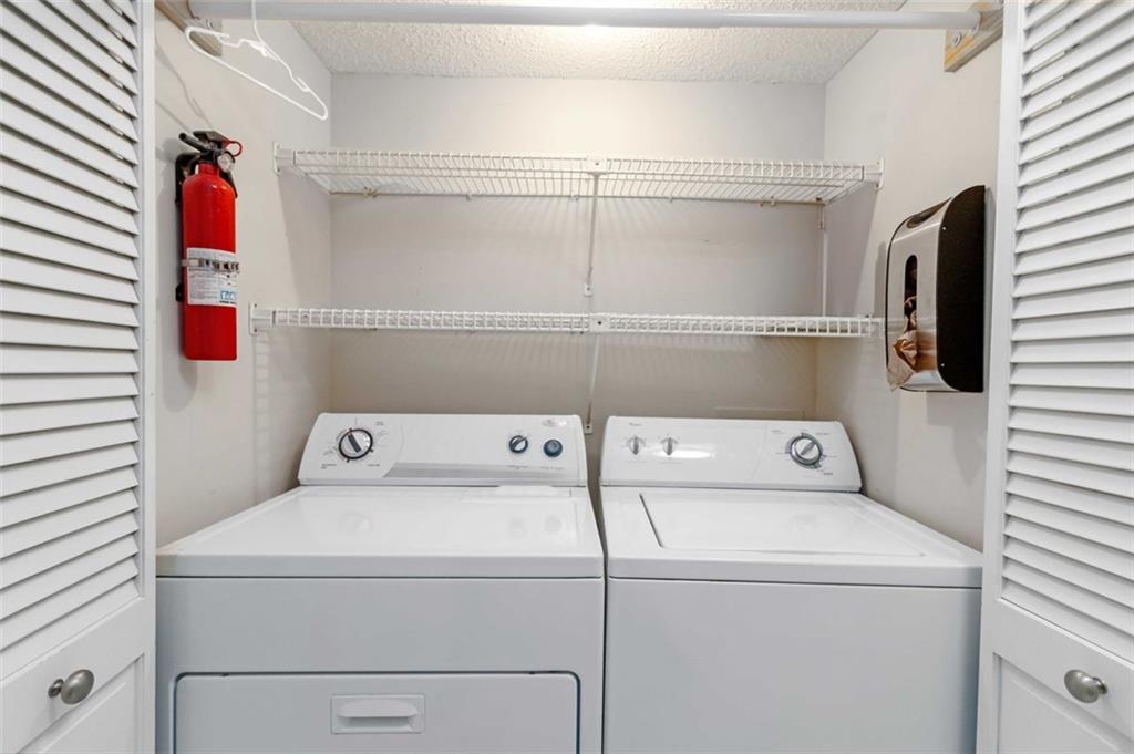 3530 Piedmont Road Northeast, Unit 5A Atlanta, GA 30305 - Photo 32 of 47 a utility room with dryer and washer