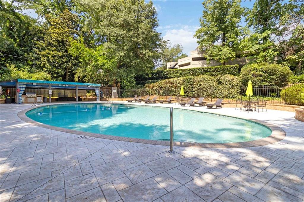 3530 Piedmont Road Northeast, Unit 5A Atlanta, GA 30305 - Photo 37 of 47 a view of a house with a yard