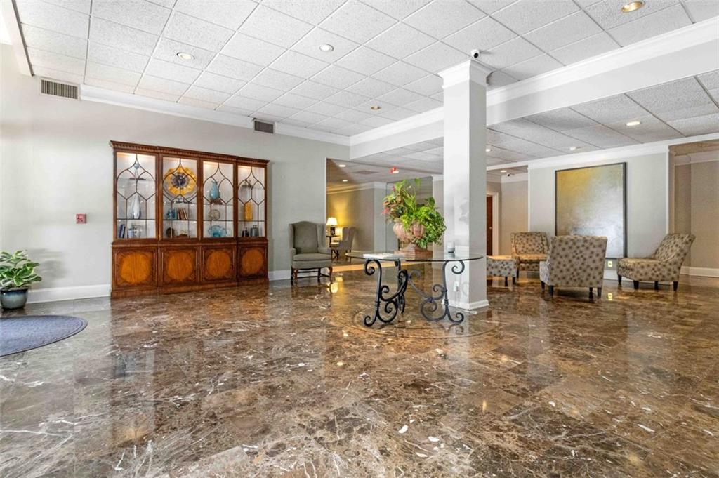 3530 Piedmont Road Northeast, Unit 5A Atlanta, GA 30305 - Photo 40 of 47 a living room with furniture and large windows