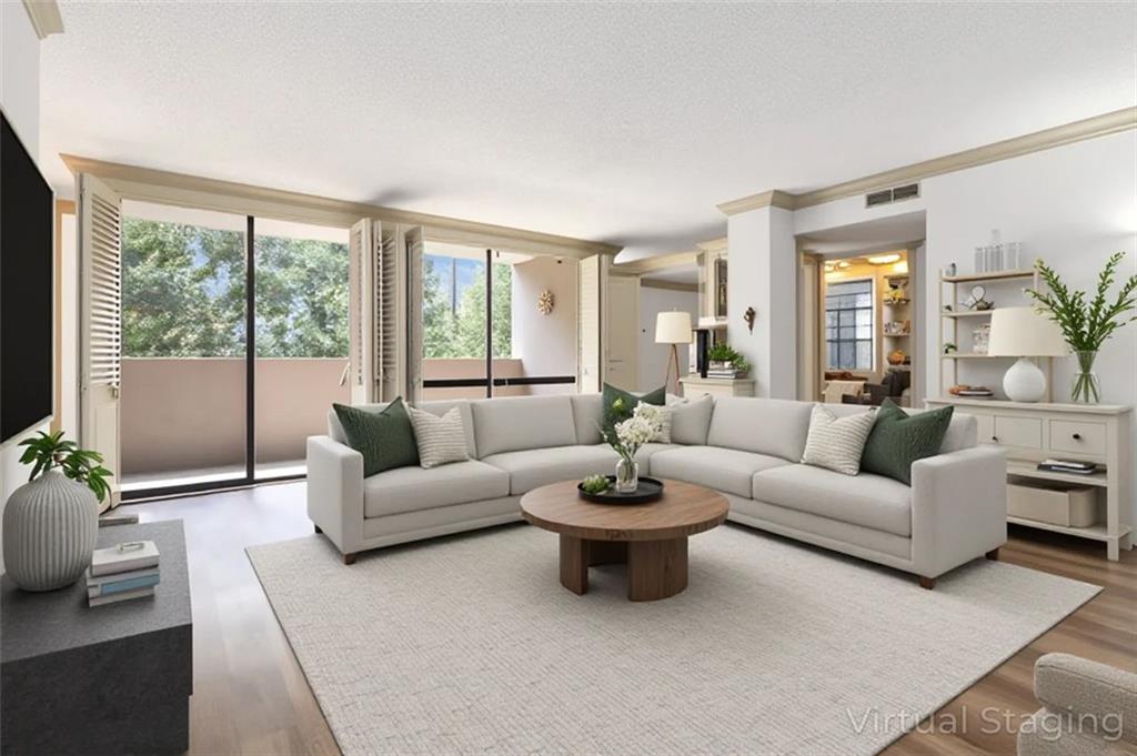 3530 Piedmont Road Northeast, Unit 5A Atlanta, GA 30305 - Photo 46 of 47 a living room with furniture and a large window