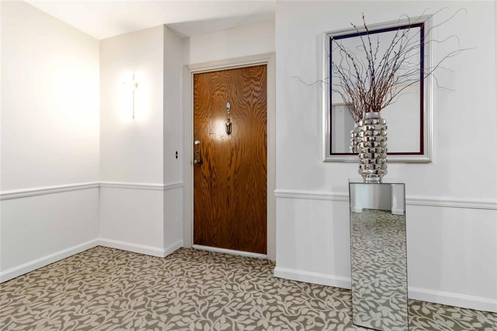 3530 Piedmont Road Northeast, Unit 5A Atlanta, GA 30305 - Photo 7 of 47 a view of a hallway with a window