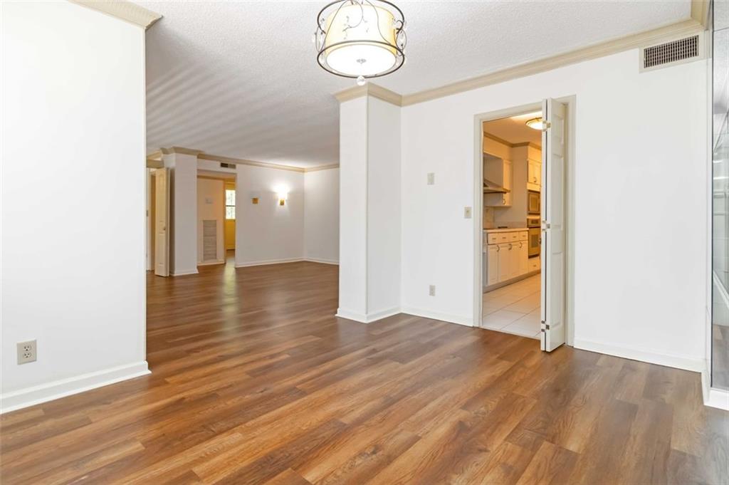 3530 Piedmont Road Northeast, Unit 5A Atlanta, GA 30305 - Photo 10 of 47 a view of a hallway with wooden floor