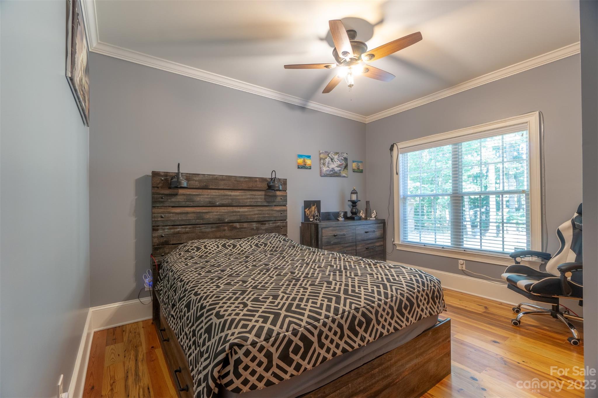 240 River Country Road Salisbury, NC 28146 - Photo 13 of 48 a bed sitting in a bedroom next to a window