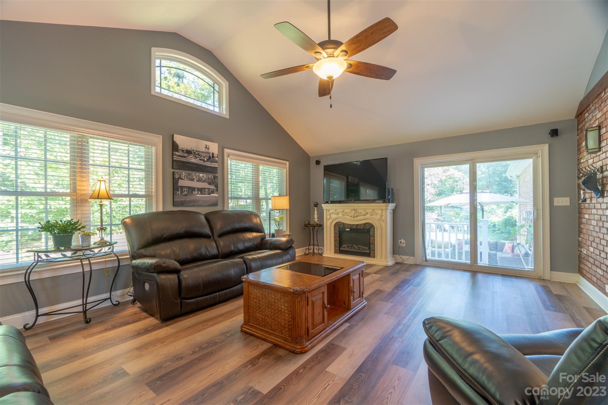 240 River Country Road Salisbury, NC 28146 - Photo 17 of 48 a living room with furniture fireplace and a large window