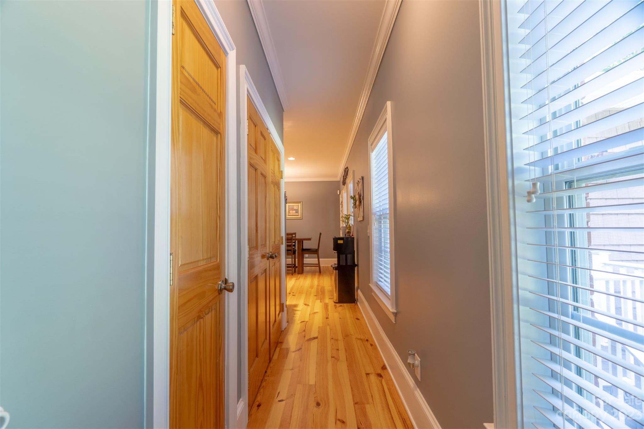 240 River Country Road Salisbury, NC 28146 - Photo 19 of 48 a view of a hallway with wooden floor and a bathroom