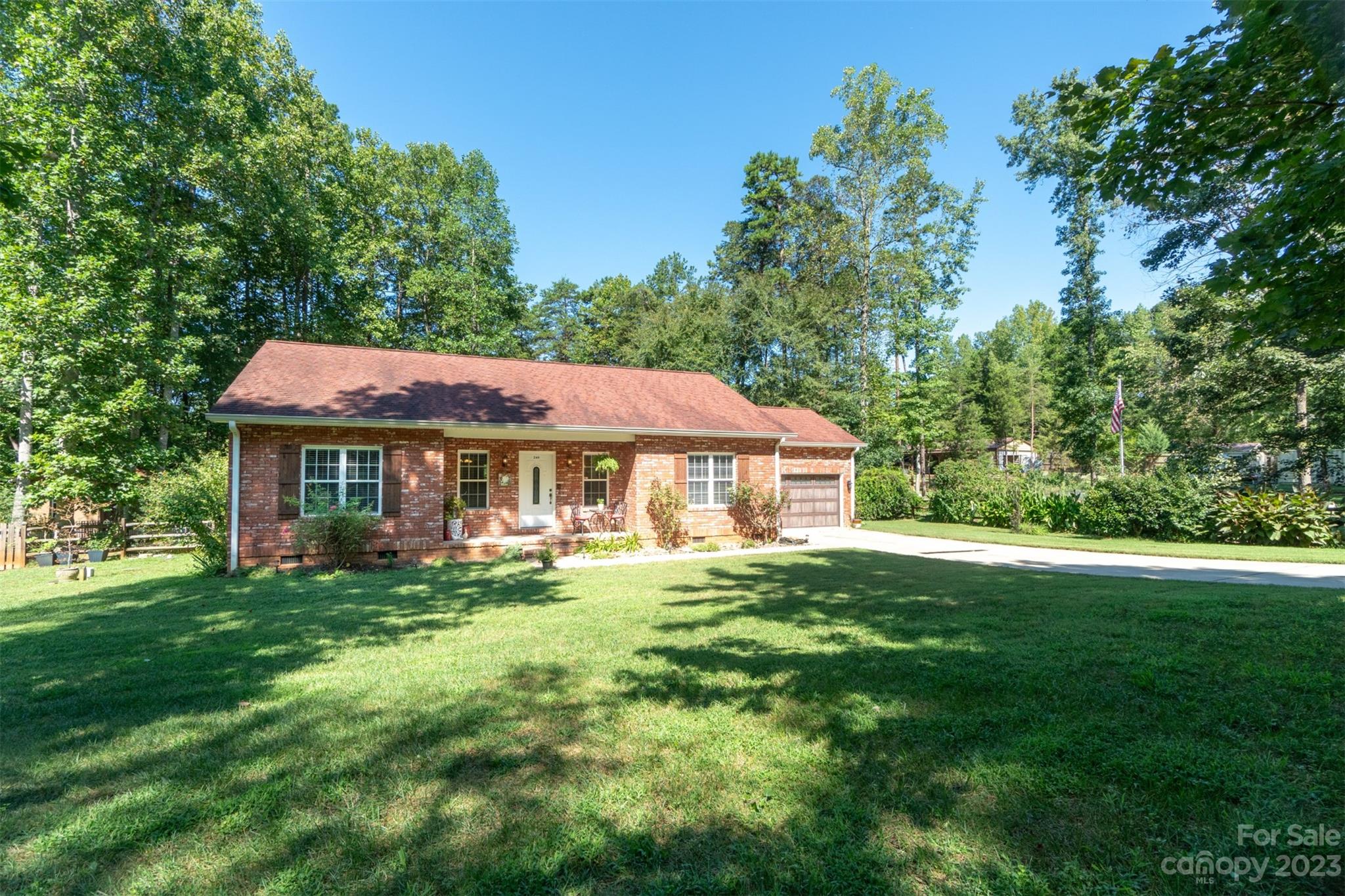 240 River Country Road Salisbury, NC 28146 - Photo 2 of 48 a front view of a house with a garden