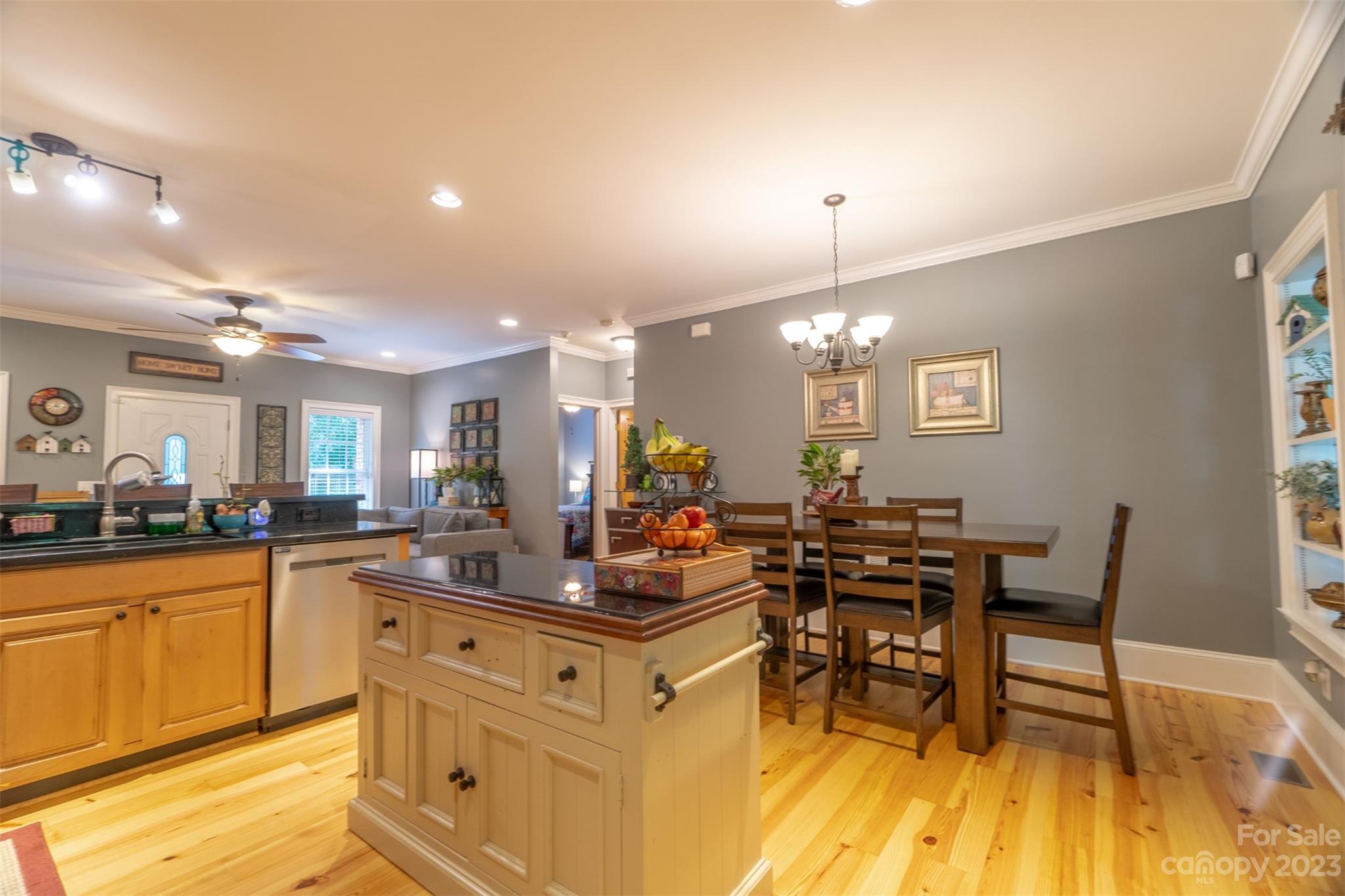 240 River Country Road Salisbury, NC 28146 - Photo 22 of 48 a kitchen with stainless steel appliances granite countertop dining table chairs and granite counter tops