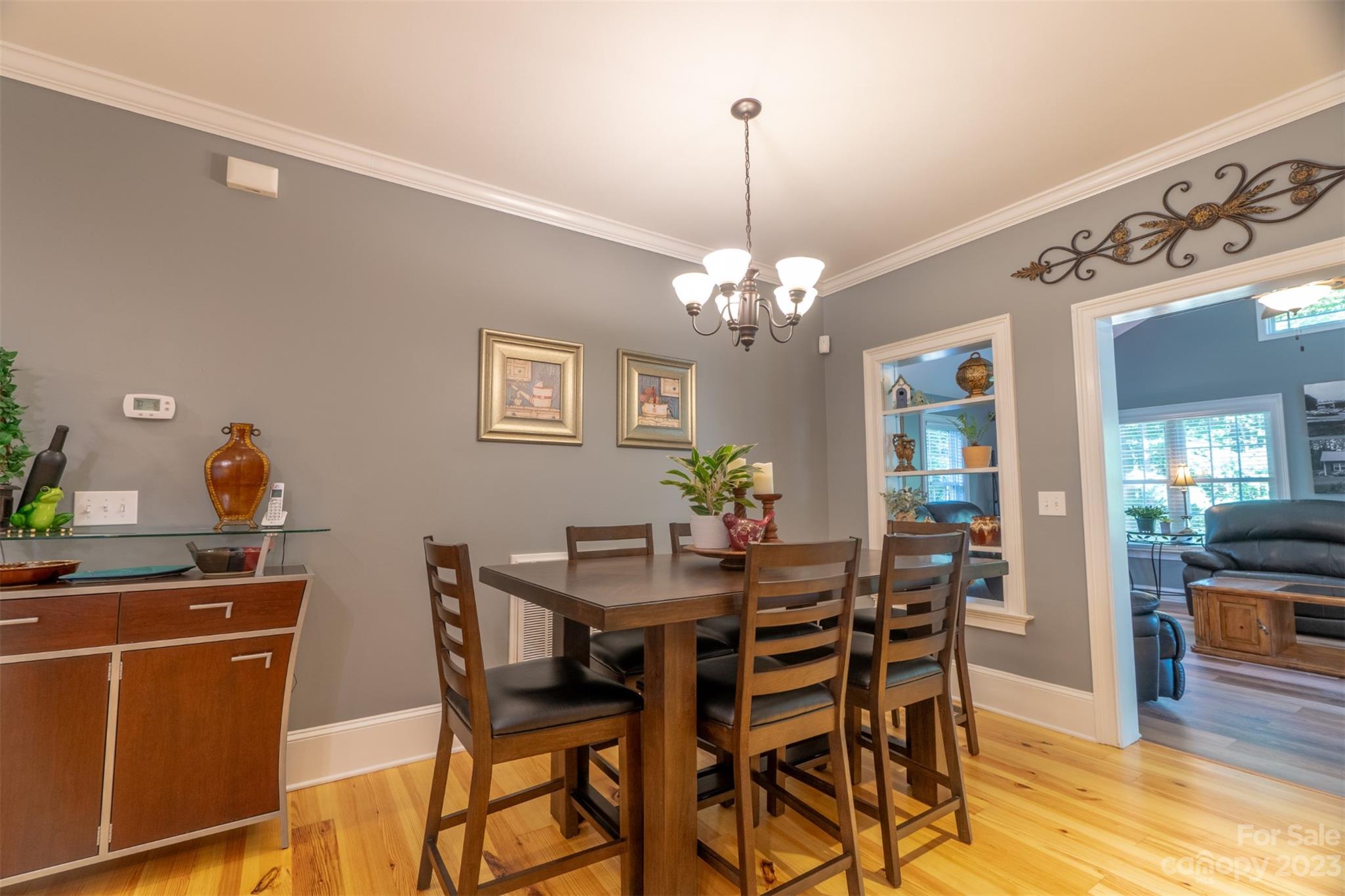 240 River Country Road Salisbury, NC 28146 - Photo 24 of 48 a view of a dining room with furniture and wooden floor
