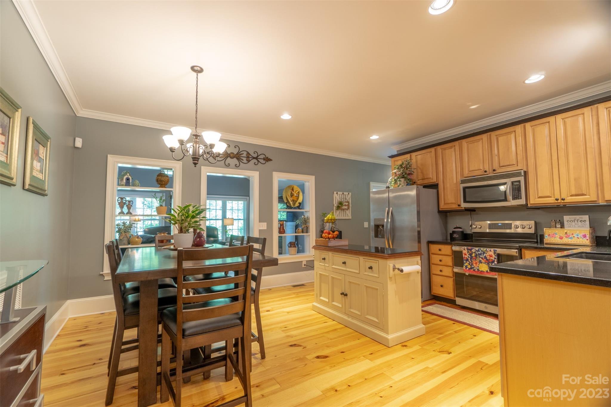 240 River Country Road Salisbury, NC 28146 - Photo 25 of 48 a view of a kitchen with kitchen island stainless steel appliances a stove a sink a center island a stove and a cabinets