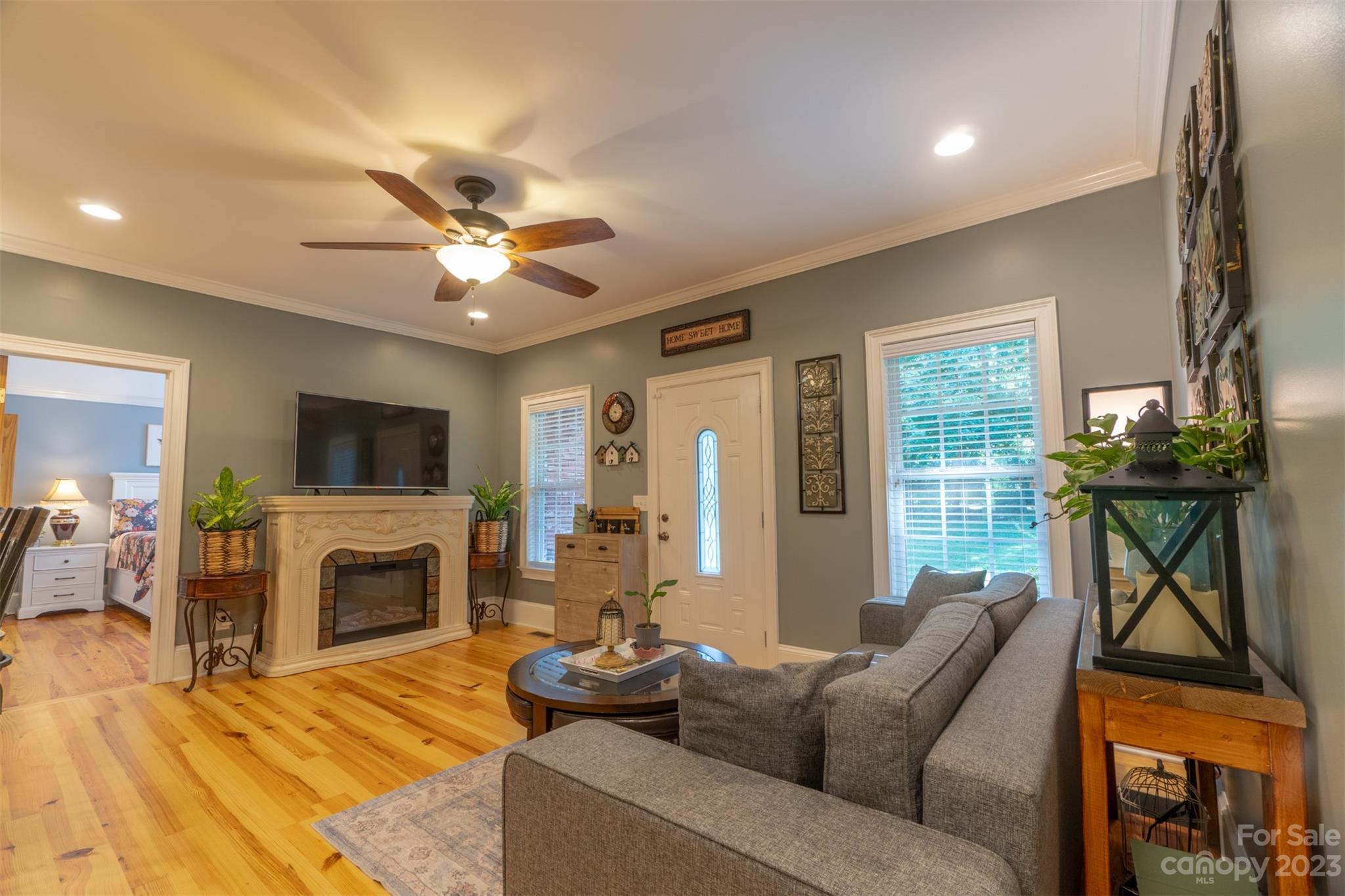 240 River Country Road Salisbury, NC 28146 - Photo 27 of 48 a living room with furniture a fireplace and a flat screen tv