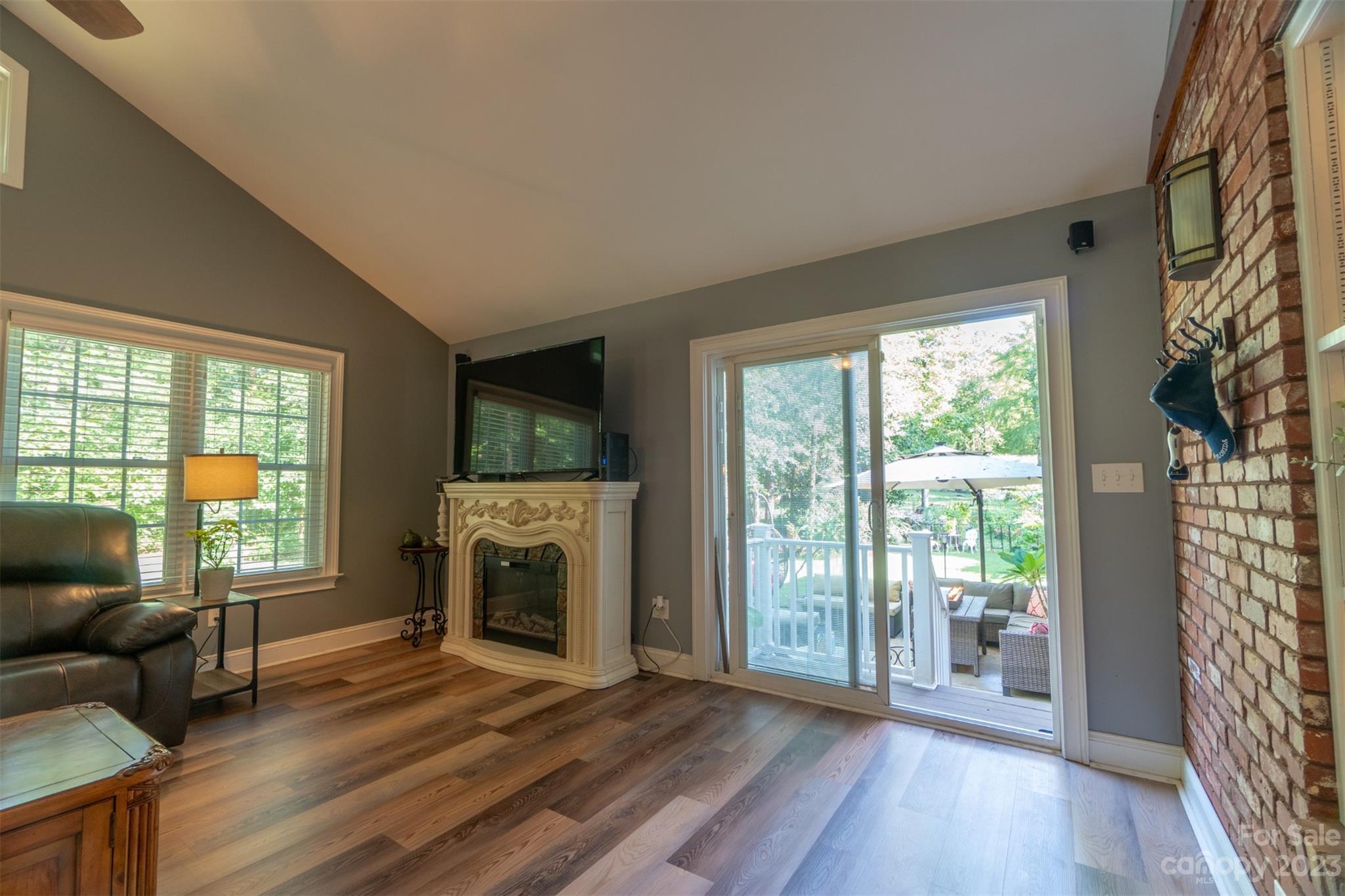 240 River Country Road Salisbury, NC 28146 - Photo 30 of 48 a living room with furniture and a fireplace