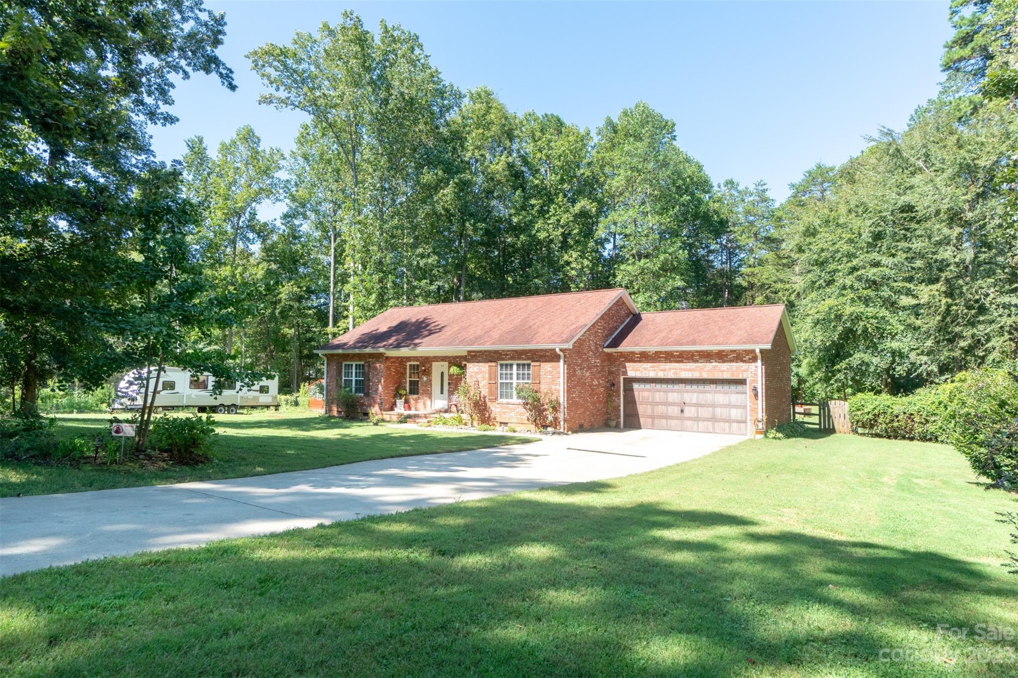 240 River Country Road Salisbury, NC 28146 - Photo 3 of 48 a view of a house with a big yard potted plants and large trees