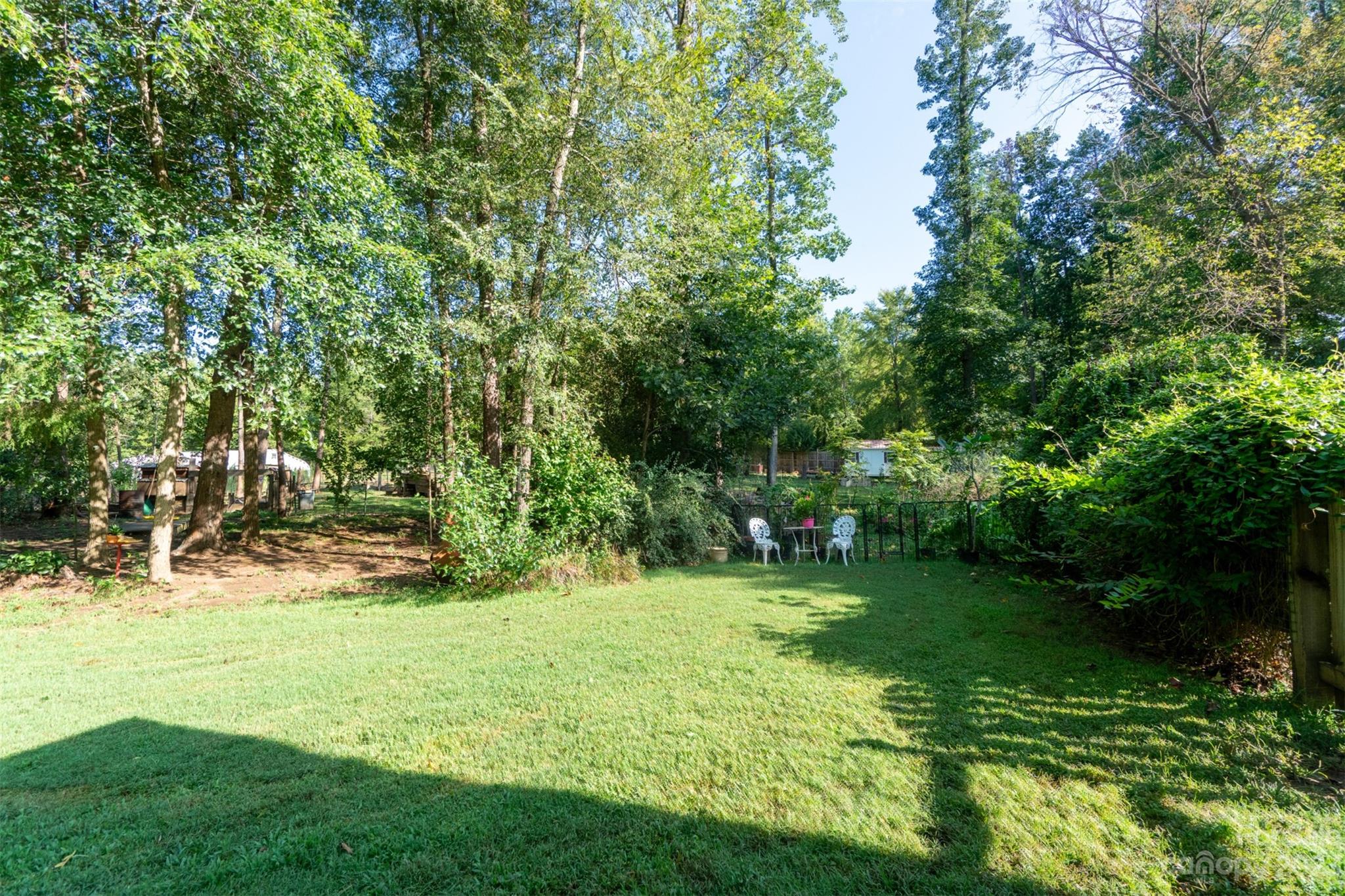 240 River Country Road Salisbury, NC 28146 - Photo 32 of 48 a view of green field with trees in the background