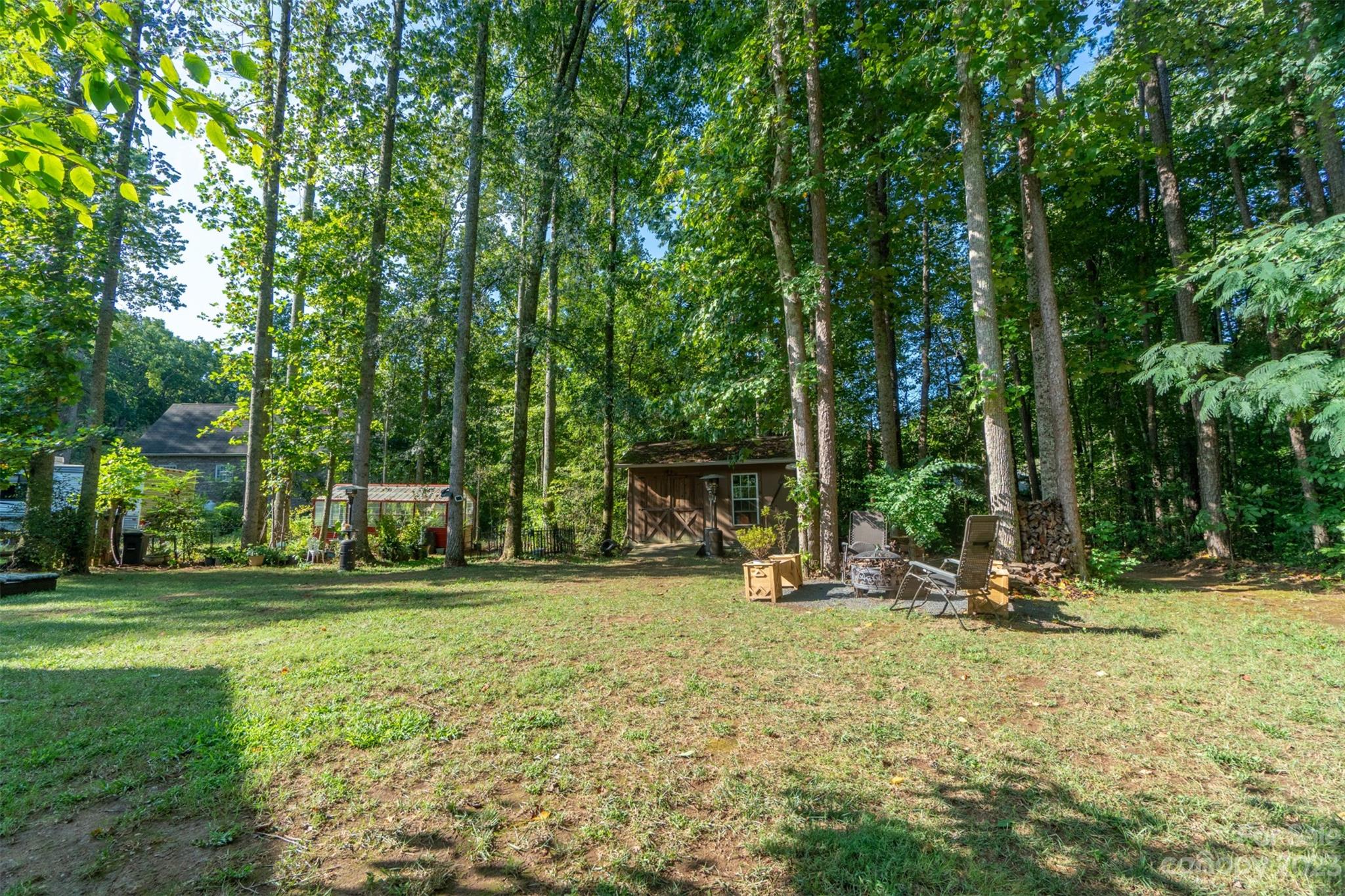 240 River Country Road Salisbury, NC 28146 - Photo 36 of 48 a backyard of a house with barbeque oven