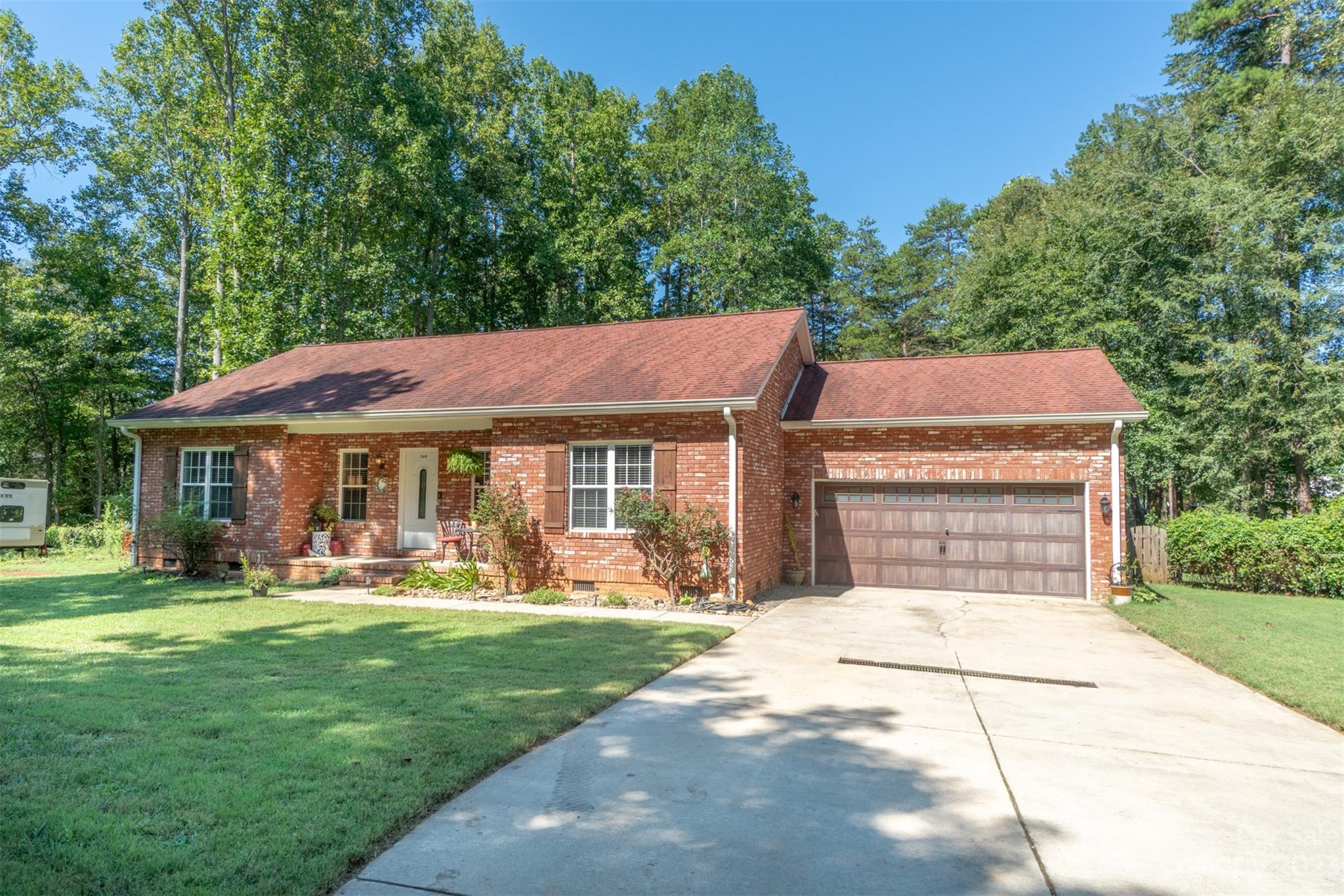 240 River Country Road Salisbury, NC 28146 - Photo 4 of 48 a view of a house with a yard porch and sitting area