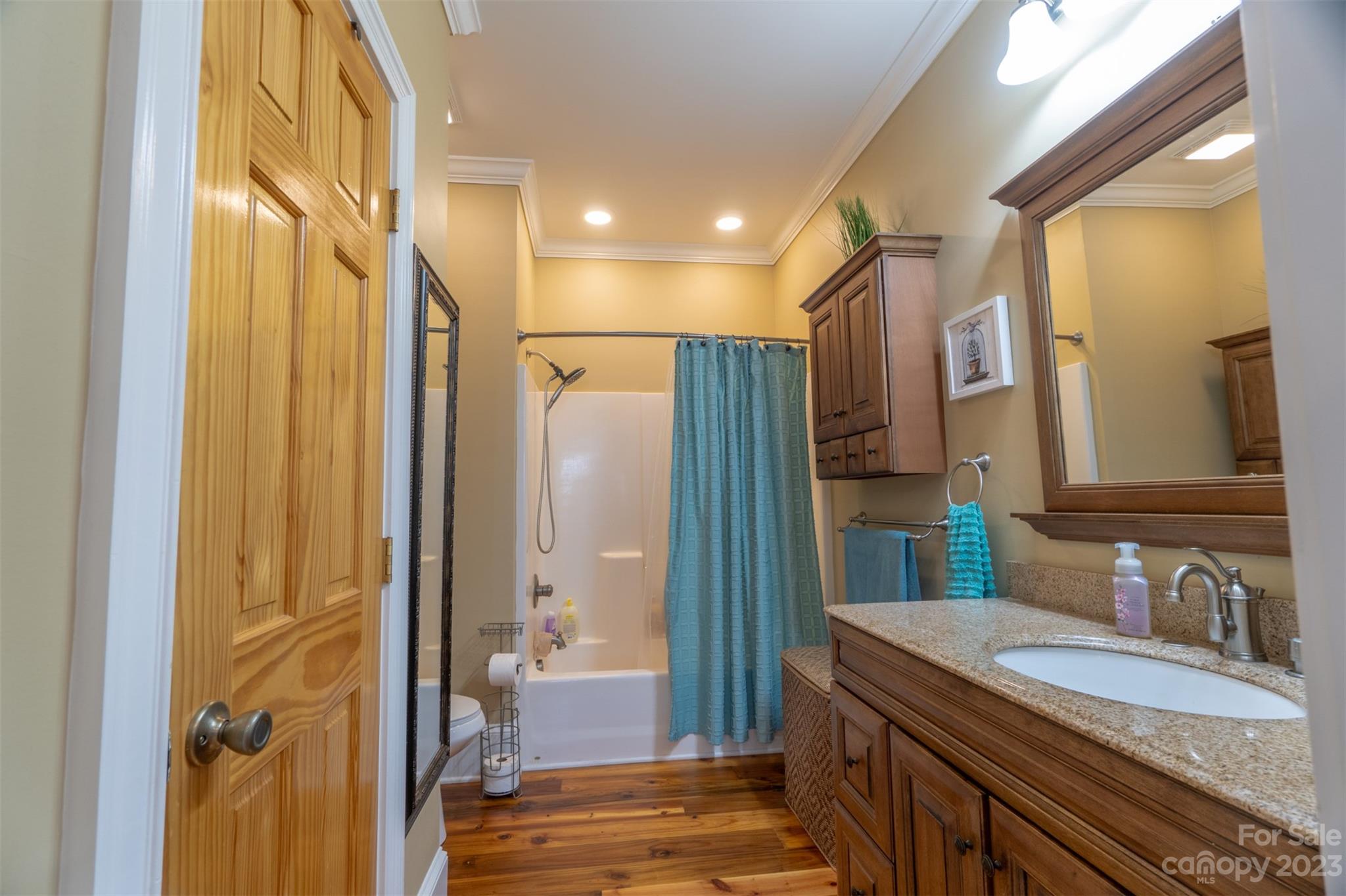 240 River Country Road Salisbury, NC 28146 - Photo 8 of 48 a bathroom with a granite countertop sink a mirror and a shower