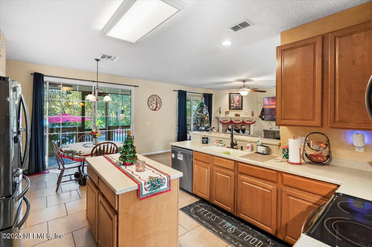 2493 Tall Cedars Road Fleming Island, FL 32003 - Photo 15 of 68 a kitchen that has a sink and a stove
