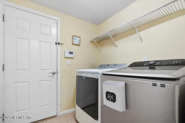 a bedroom with a bed dresser and a window