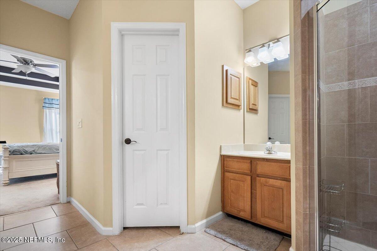 2493 Tall Cedars Road Fleming Island, FL 32003 - Photo 23 of 68 a view of a bathroom from the hallway