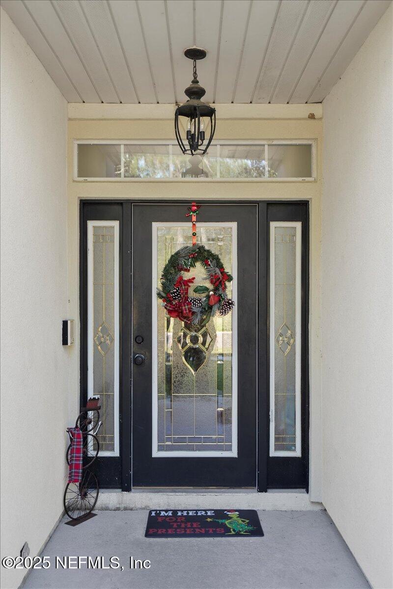 2493 Tall Cedars Road Fleming Island, FL 32003 - Photo 3 of 68 a front view of a house with entryway