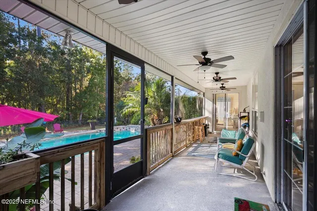 a view of a backyard with sitting area