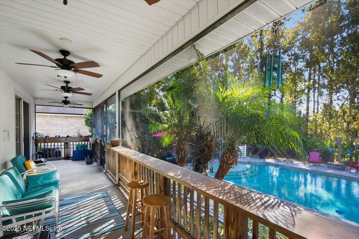 2493 Tall Cedars Road Fleming Island, FL 32003 - Photo 33 of 68 a view of a porch with furniture and garden