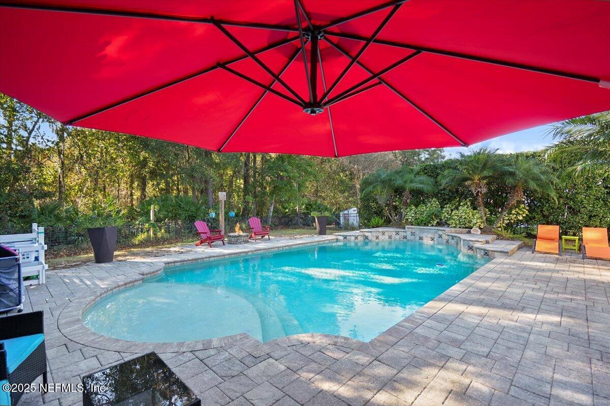 2493 Tall Cedars Road Fleming Island, FL 32003 - Photo 34 of 68 a view of a backyard with sitting area
