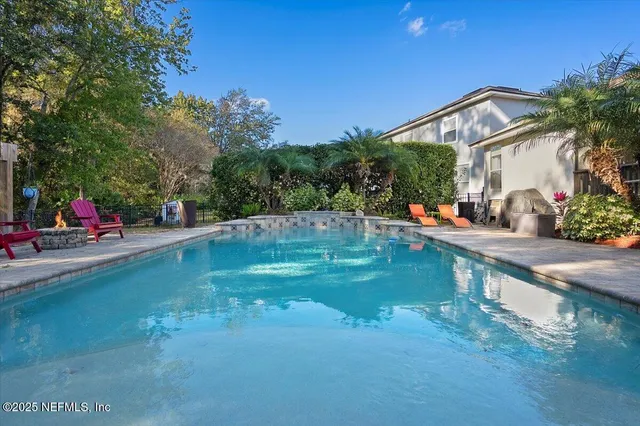 a view of a park with large trees