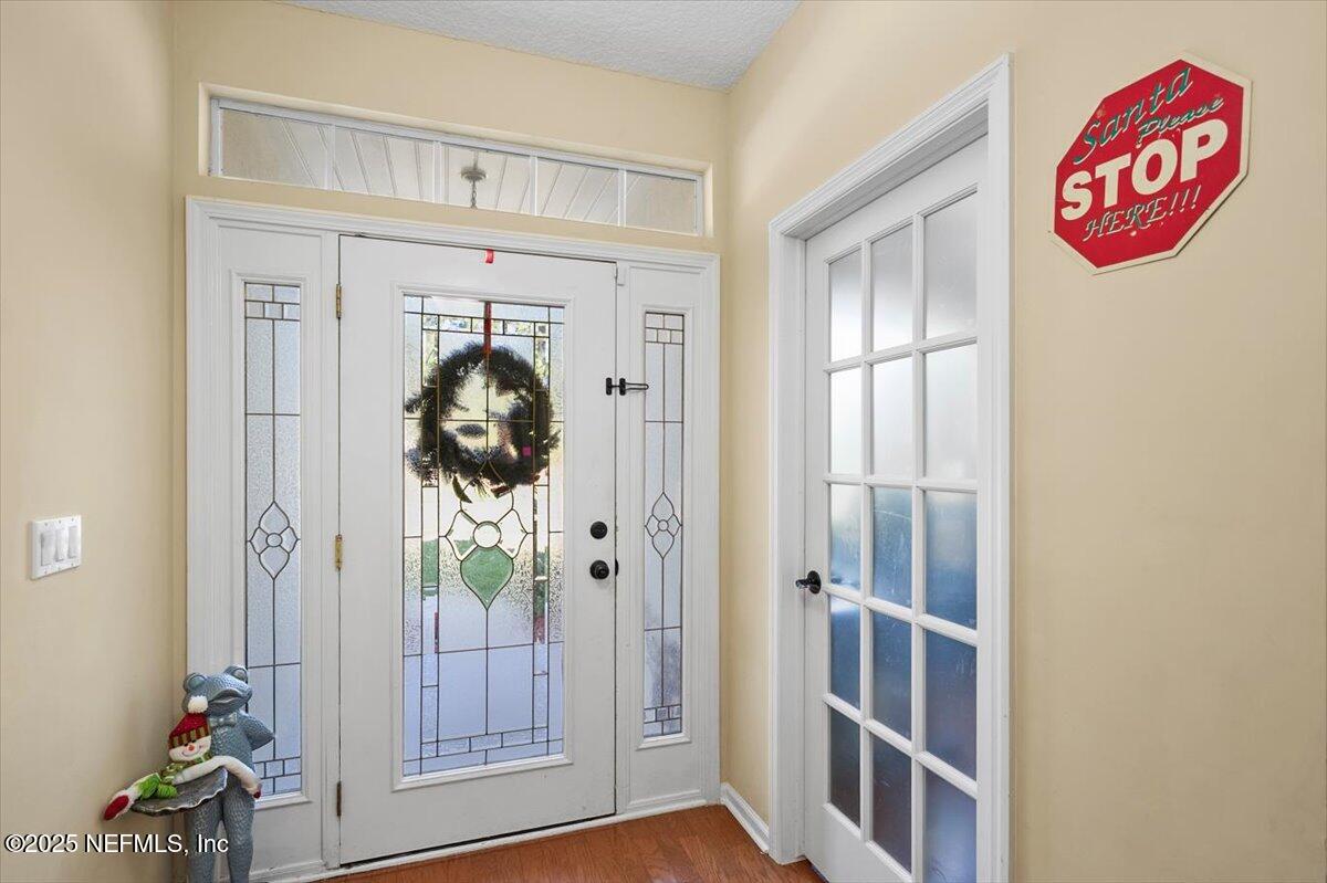 2493 Tall Cedars Road Fleming Island, FL 32003 - Photo 4 of 68 a view of entryway with wooden floor