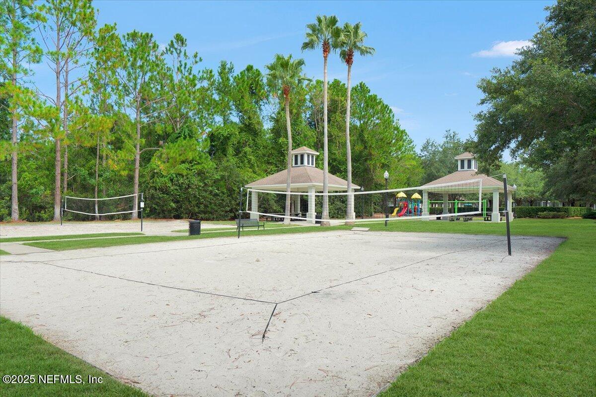 2493 Tall Cedars Road Fleming Island, FL 32003 - Photo 63 of 68 a yellow and red house with a yard