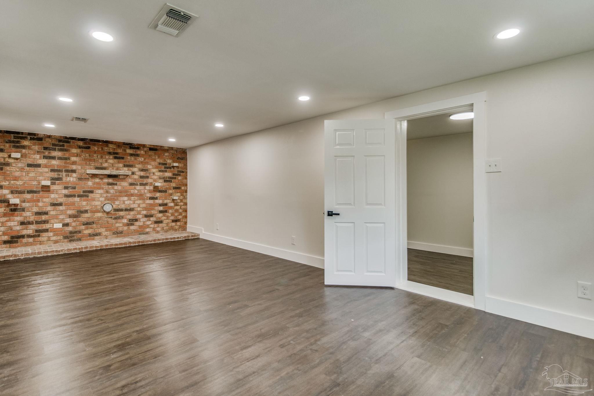 4355 Highway 95A North Molino, FL 32577 - Photo 20 of 54 an empty room with wooden floor and windows