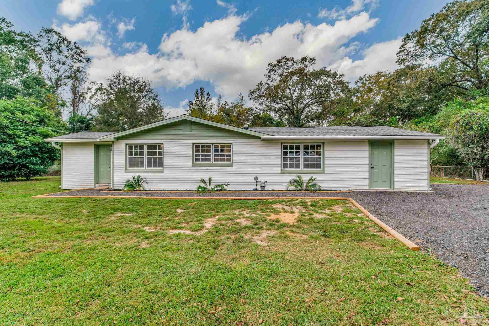 4355 Highway 95A North Molino, FL 32577 - Photo 2 of 54 a view of a house with a yard