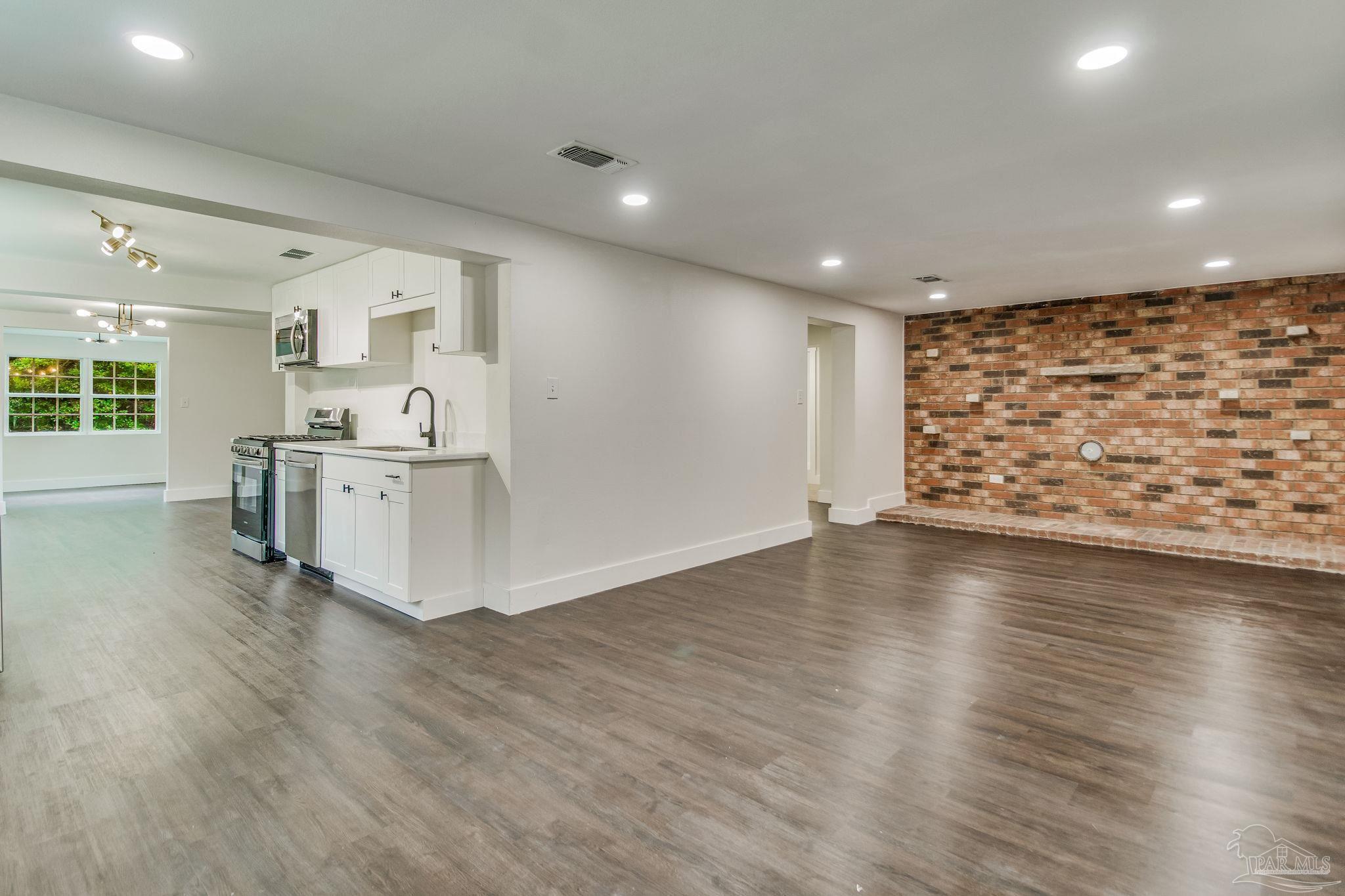 4355 Highway 95A North Molino, FL 32577 - Photo 21 of 54 an empty room with wooden floor and windows