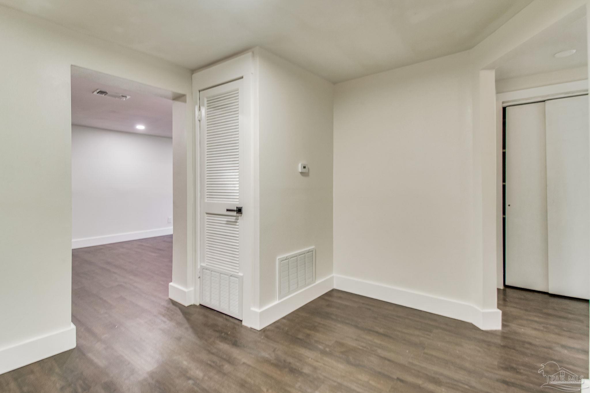 4355 Highway 95A North Molino, FL 32577 - Photo 25 of 54 an empty room with wooden floor and entrance