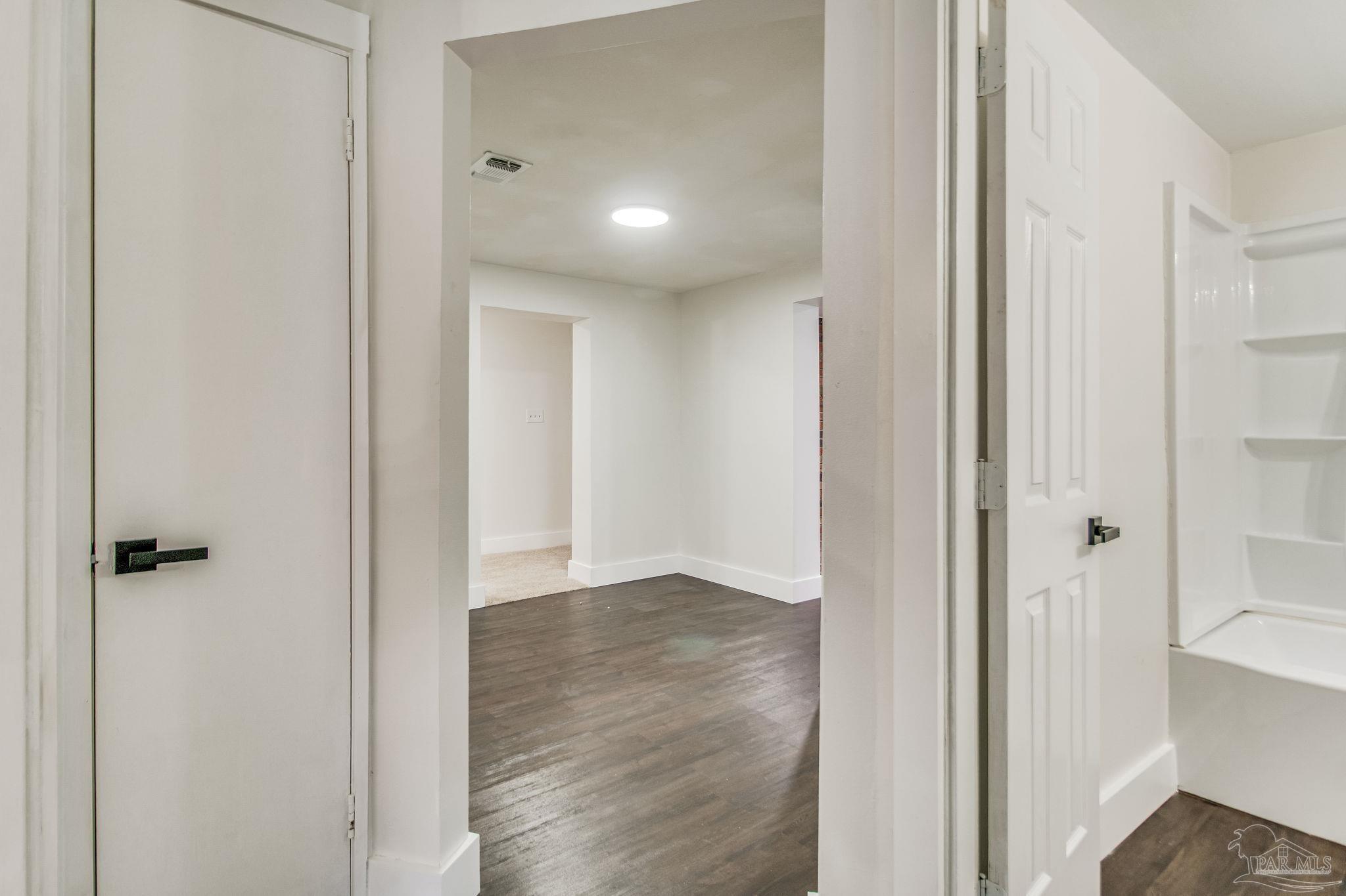 4355 Highway 95A North Molino, FL 32577 - Photo 26 of 54 a view of a hallway with wooden floor