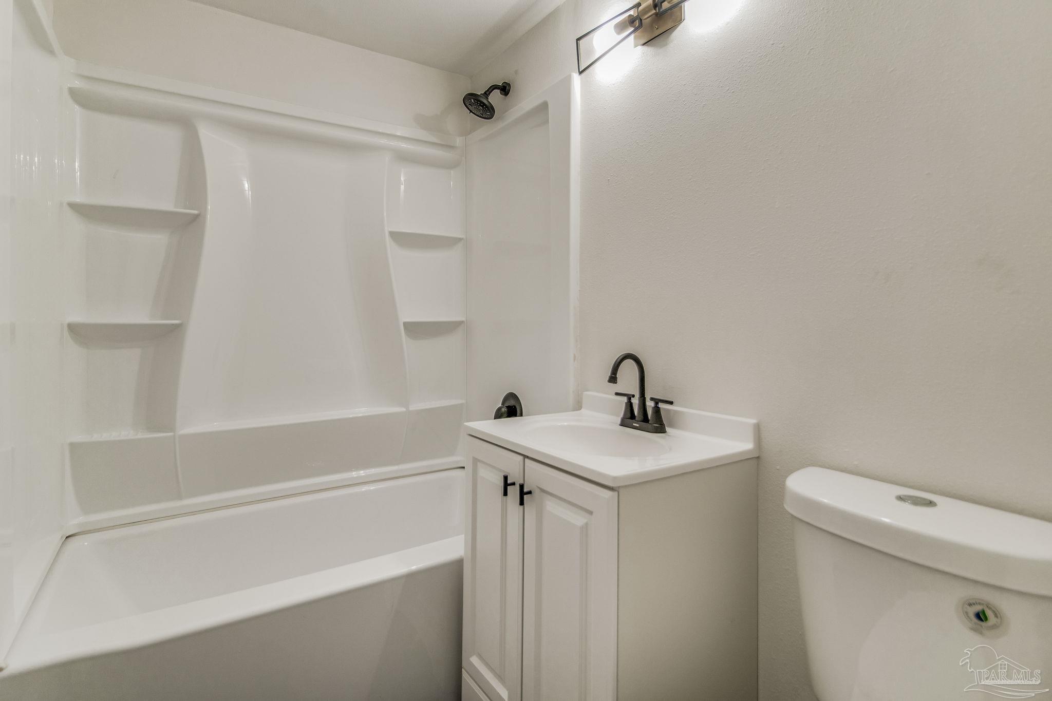 4355 Highway 95A North Molino, FL 32577 - Photo 30 of 54 a bathroom with a sink a toilet and shower