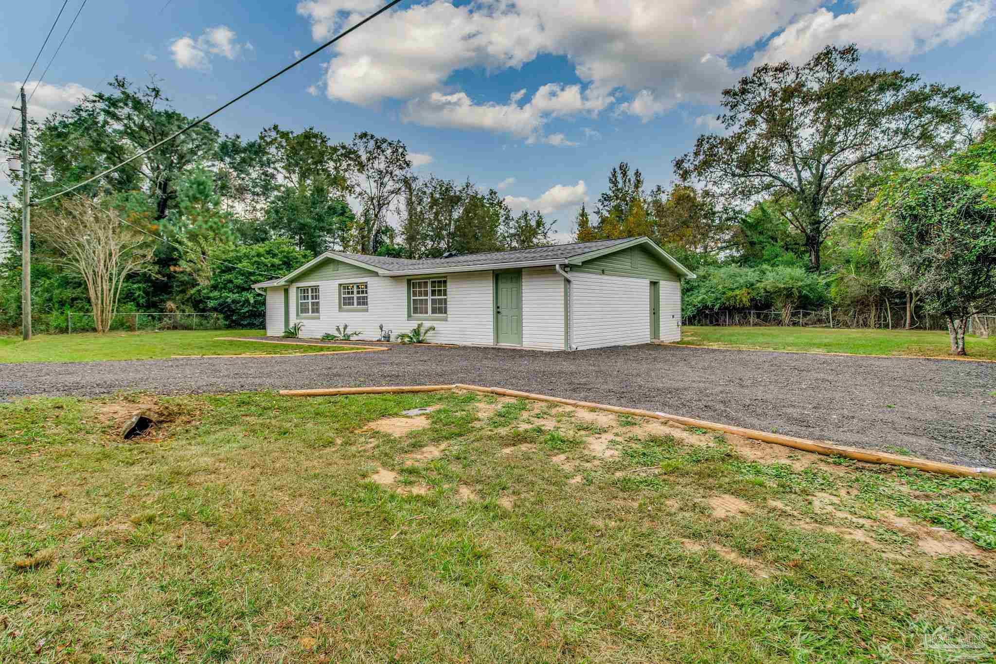 4355 Highway 95A North Molino, FL 32577 - Photo 3 of 54 a view of an house with backyard space and balcony