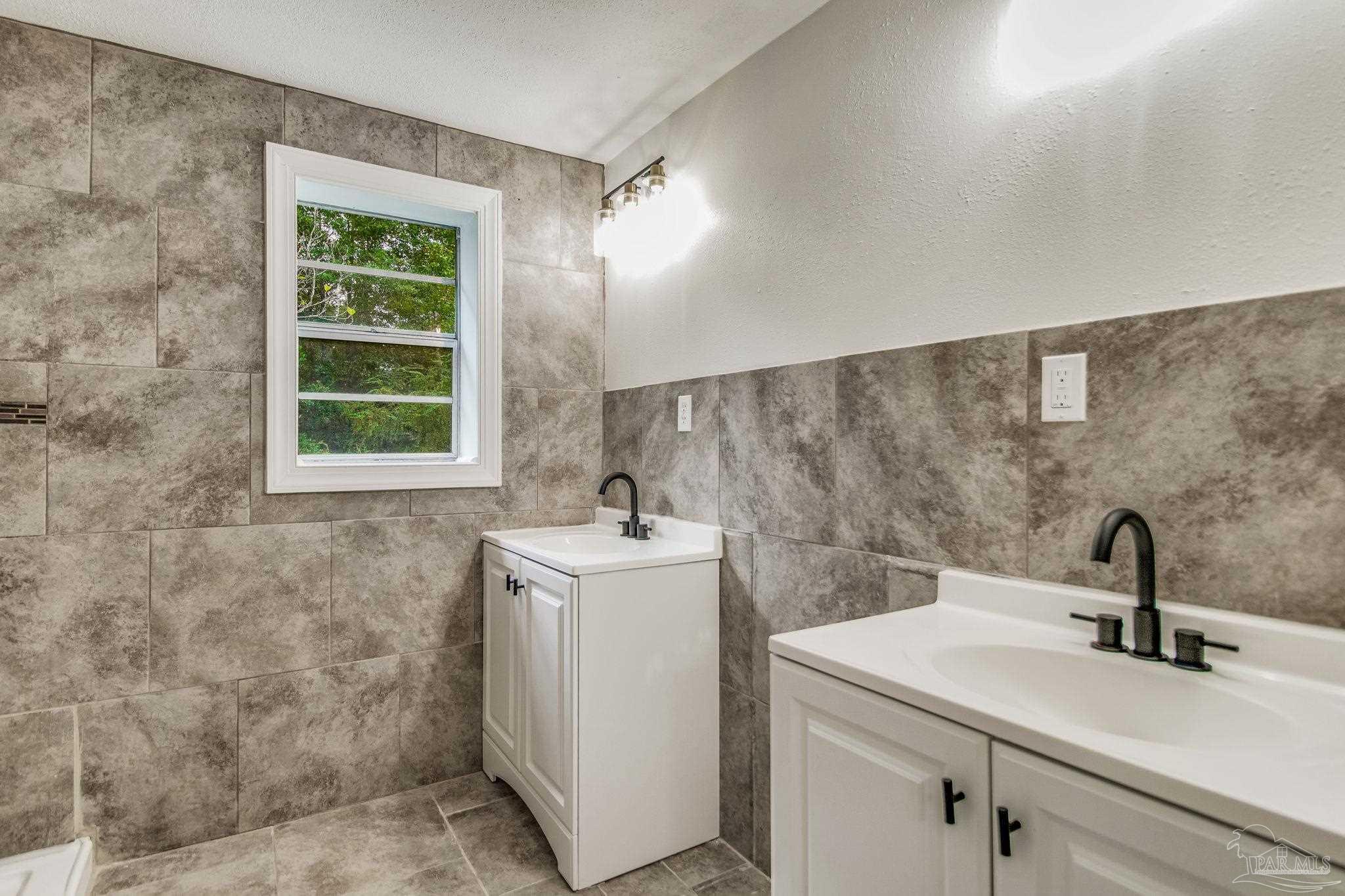 4355 Highway 95A North Molino, FL 32577 - Photo 39 of 54 a bathroom with a sink and a mirror