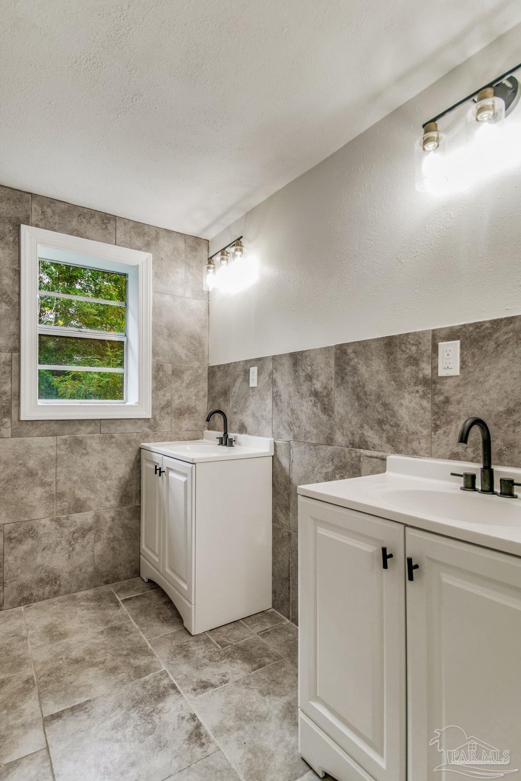 4355 Highway 95A North Molino, FL 32577 - Photo 41 of 54 a room with a sink washer and dryer