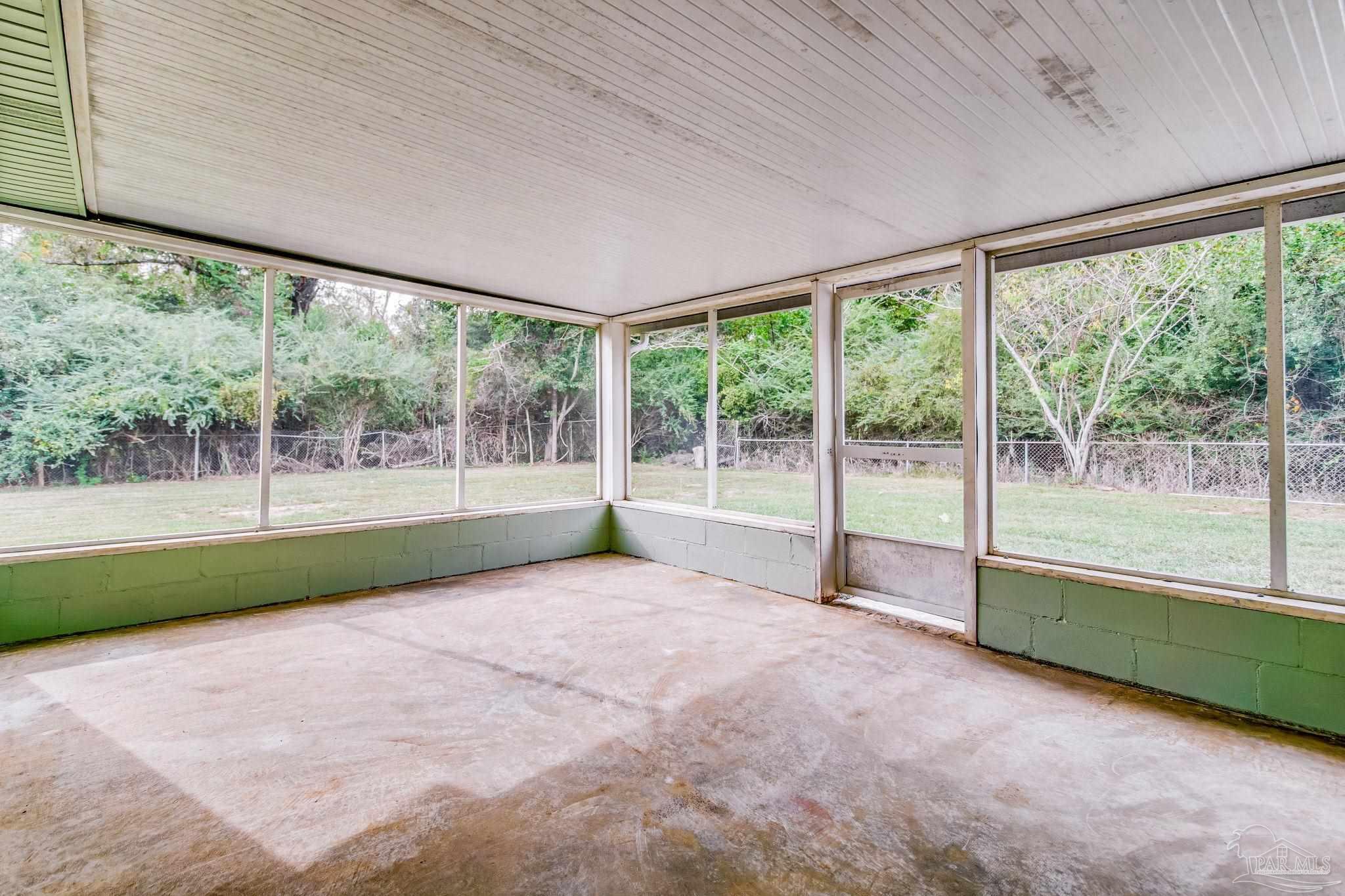 4355 Highway 95A North Molino, FL 32577 - Photo 48 of 54 a view of an empty room with wooden floor and a floor to ceiling window
